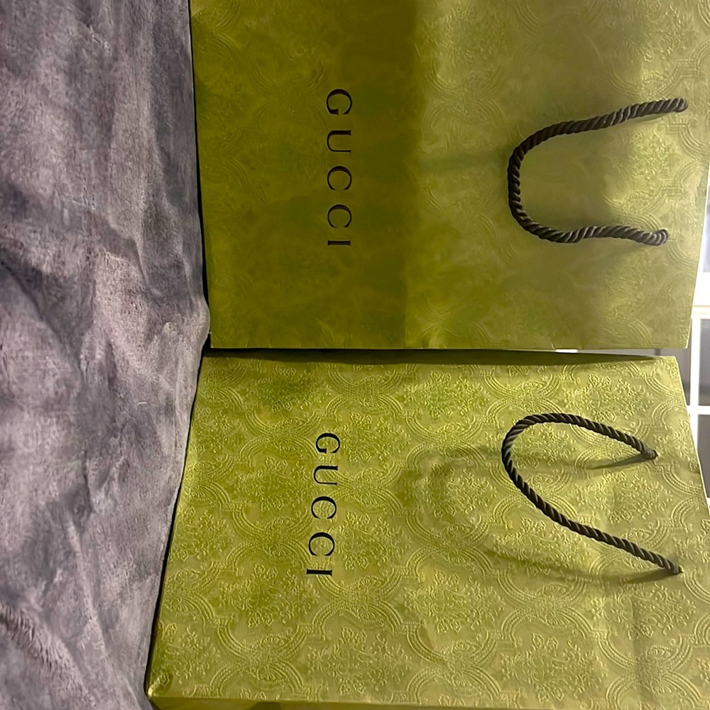 Two medium size Gucci shopping bags